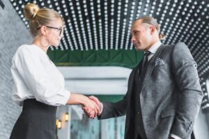 Businessman shaking hand with his partner